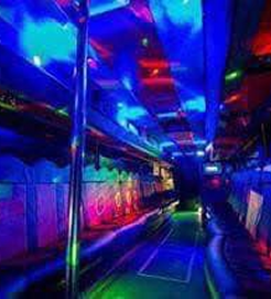 Party bus interior lit with blue and green laser lighting